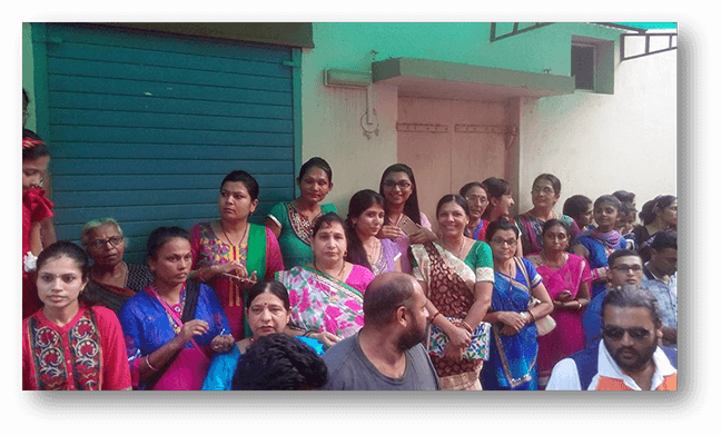 Women waiting for the passing of their idol