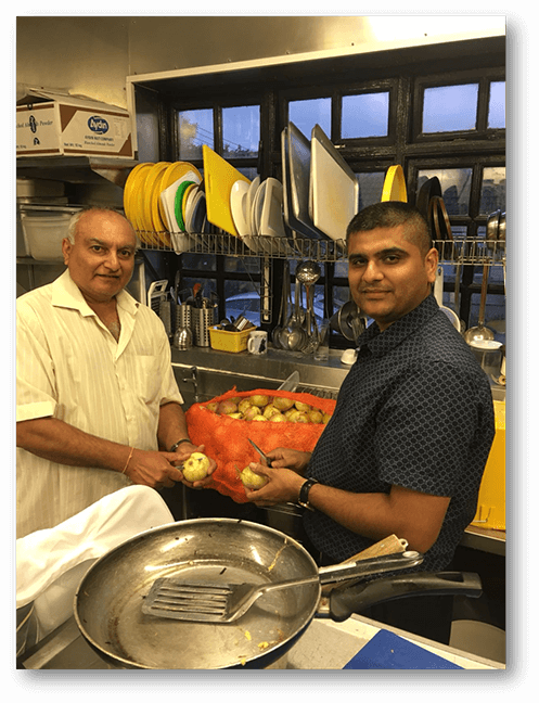 Mr. Vinesh Santilal and Mr. Rajiv Kalapi peeling onions