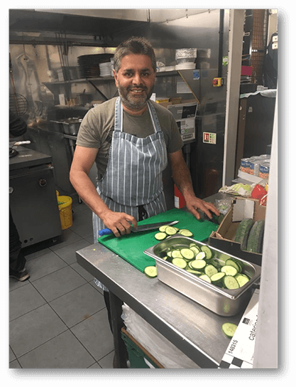 Mr. Prieche Cumudechandra chopping cucumber